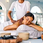 Therapist giving a back massage in a spa
